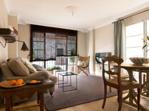 a living room with a couch and a table at Holiday Home Marbella old town by Interhome in Marbella