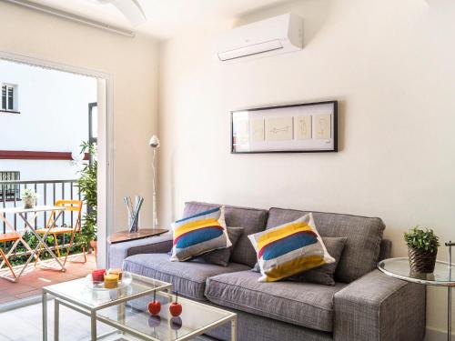 a living room with a couch and a table at Apartment Estrella del mar by Interhome in Rincón de la Victoria