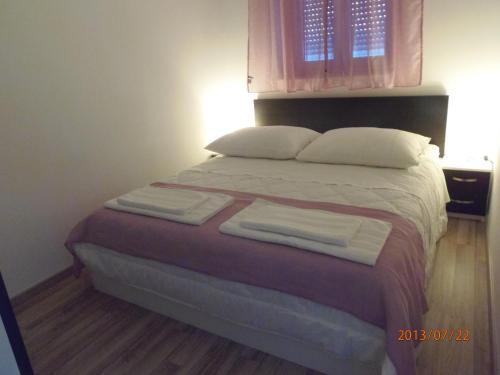 Katil atau katil-katil dalam bilik di Apartments Palma