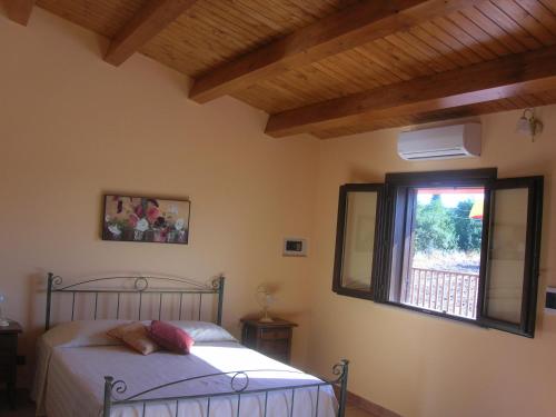 מיטה או מיטות בחדר ב-Borgo Rigolizia Vacanze