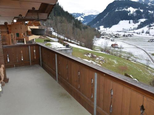 a balcony with a view of a snow covered mountain at Apartment Fabiana by Interhome in Zweisimmen