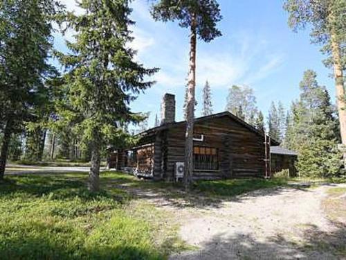 a wooden cabin in the middle of a forest at Holiday Home Metsä-luosto by Interhome in Luosto