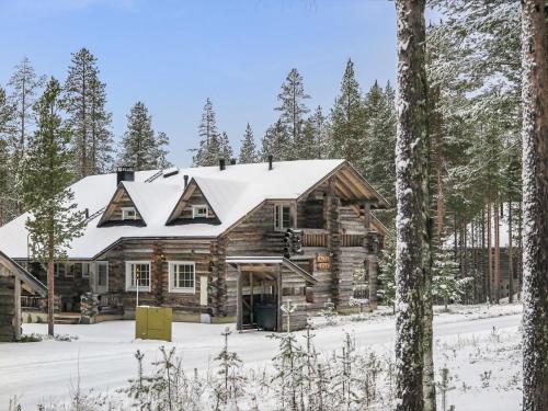 a log cabin with a snow covered roof at Holiday Home Alte levi aatu by Interhome in Levi