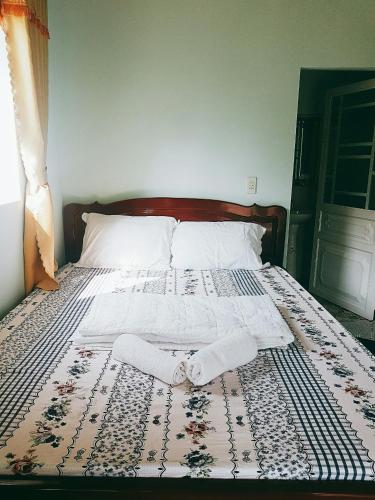Ένα ή περισσότερα κρεβάτια σε δωμάτιο στο Cat Tien Farmer Lodge