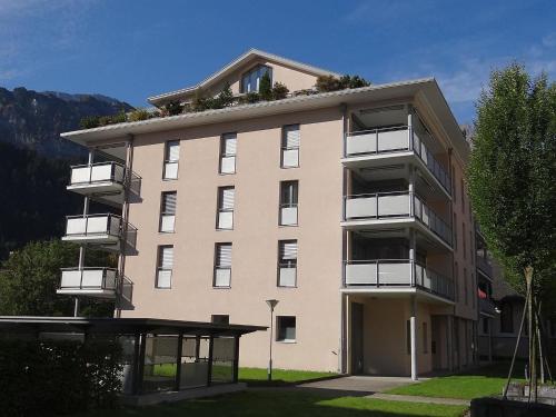 a large building with balconies on the side of it at Apartment Hess Park by Interhome in Engelberg