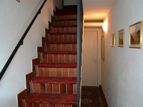 een trap in een huis met een glazen trap bij Apartment Oberland Nr- 29 by Interhome in Gstaad