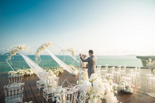 a wedding ceremony on the deck of a cruise ship at Sanya Conifer Resort in Sanya