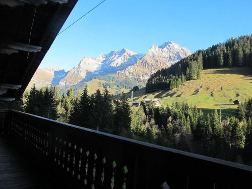 a view of a mountain range from a balcony at Apartment Gilbachhöckli 2 by Interhome in Adelboden
