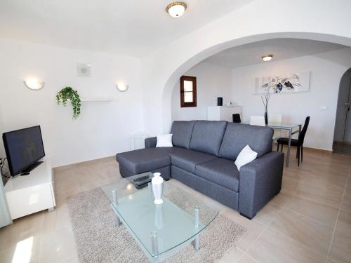 a living room with a couch and a table at Holiday Home AmareMonte by Interhome in Benissa