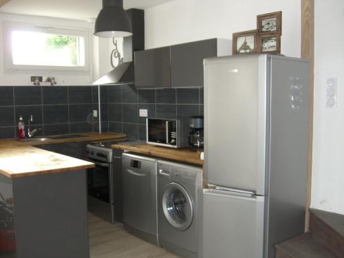 Kuchyň nebo kuchyňský kout v ubytování Holiday Home Maison Les Oies by Interhome