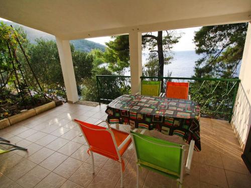 a patio with a table and chairs on a balcony at Apartment Dijana-1 by Interhome in Prigradica