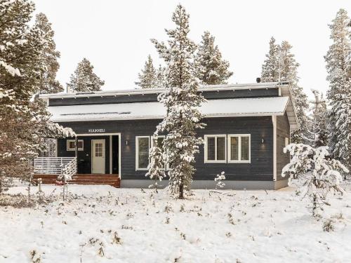 a small house in the snow with trees at Holiday Home Kuukkeli by Interhome in Kyrö