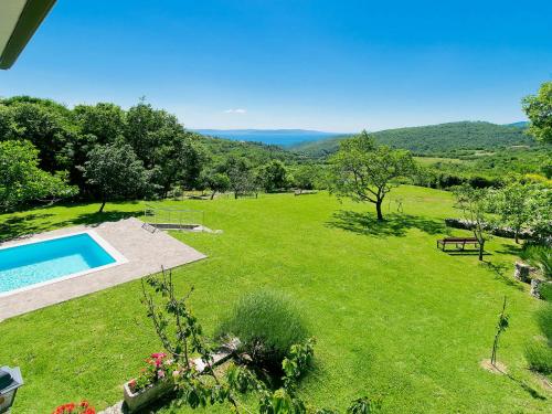 an image of a garden with a swimming pool at Holiday Home Panorama 2 by Interhome in Labin