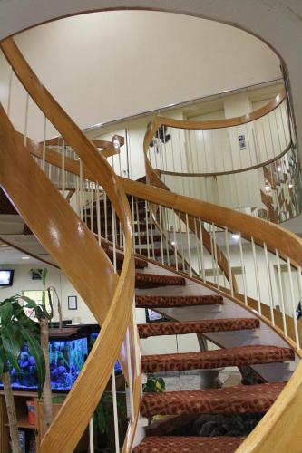 a wooden spiral staircase in a house at Schooner II Beach and Racquet Club in Myrtle Beach
