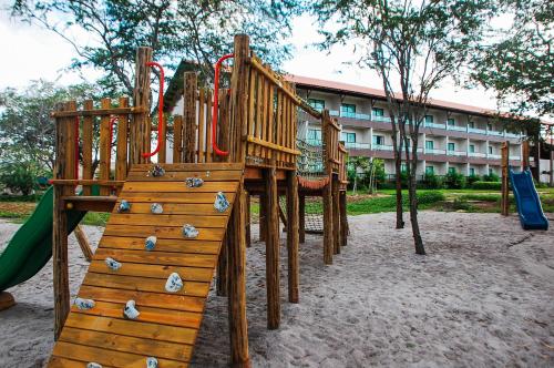 a playground in a park with a slide at Hotel Canarius de Gravatá in Gravatá