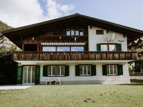 a large house with a balcony on top of it at Apartment Bärggeist by Interhome in Adelboden