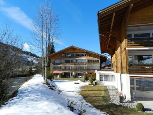a building with snow in front of it at Apartment La Sarine 212 by Interhome in Gstaad