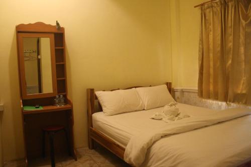 Postel nebo postele na pokoji v ubytování Viengchalern Guesthouse