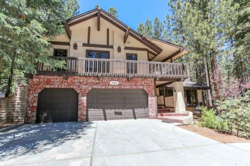 a house with a balcony on top of a garage at The Lodge at Snow Summit Home in Big Bear Lake