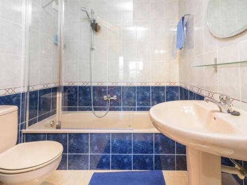 a bathroom with a shower and a sink and a toilet at Apartment Montanar Luz by Interhome in Jávea