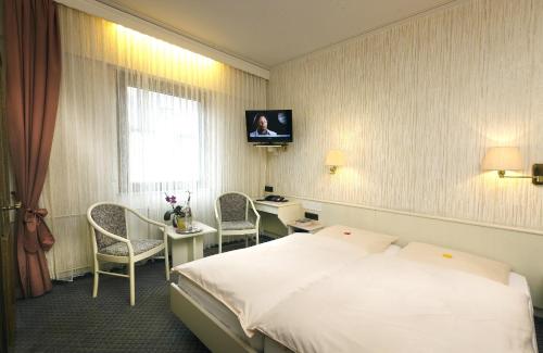 Postel nebo postele na pokoji v ubytování Hotel Pohl