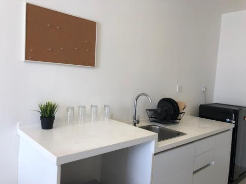 a kitchen with a sink and a counter top at TREFOIL, WEE 816 STUDIO in Setia Alam