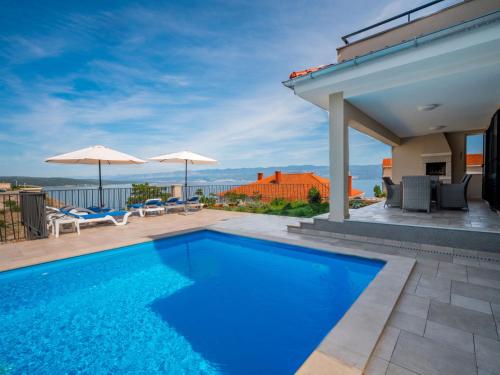 a swimming pool on top of a house at Villa Vali 1 by Interhome in Vrbnik