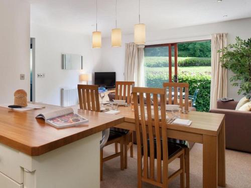 a kitchen and dining room with a table and chairs at Holiday Home The Valley by Interhome in Perranwell