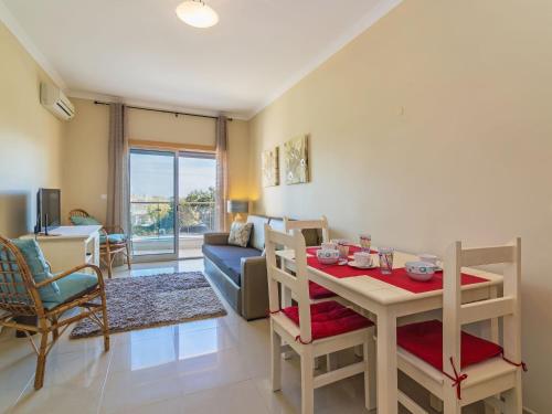 a living room with a table and a dining room at Apartment Monte da Eira by Interhome in Brejos