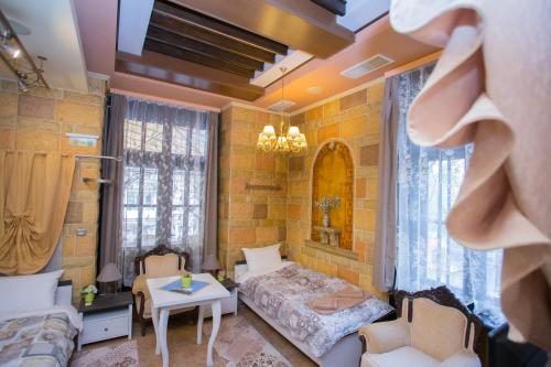 a bedroom with a bed in a room with bricks at Guest House Marrakech in Gabrovo
