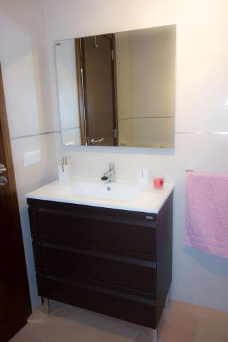 a bathroom with a sink and a mirror at Ca na Mora in Campanet