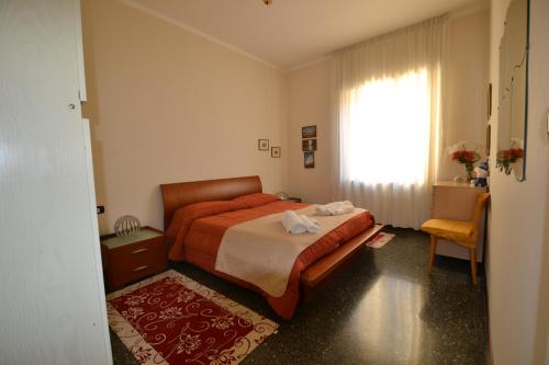 a small bedroom with a bed and a window at Magenta Apartment in Varese