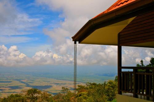 a view of a valley from a roof of a house at The Jerai Hill Resort in Yan