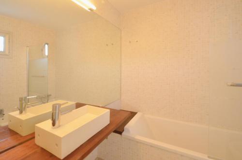 a bathroom with two sinks and a bath tub at Bellavista - Ref. 029 in Begur