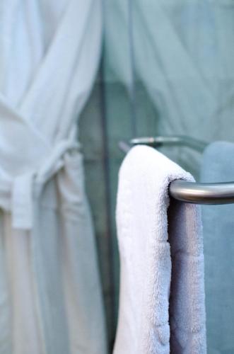 a towel hanging on a towel rack in a bathroom at Luxury House in Shymkent