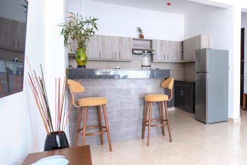 Una cocina o cocineta en L'Aziz Suites