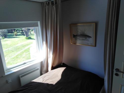 En eller flere senge i et værelse på Feriehus Roskilde fjord