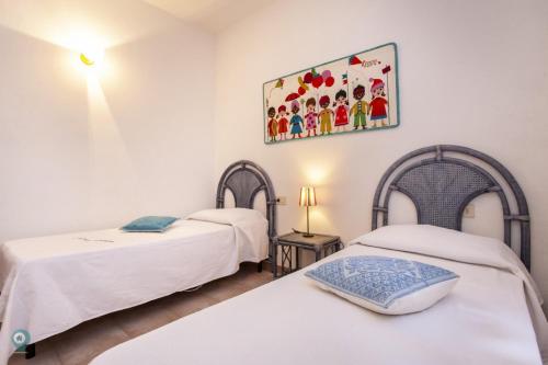 Postel nebo postele na pokoji v ubytování Villino Funtana