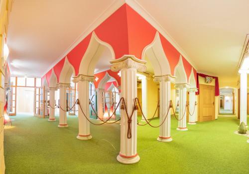 a childrens play area in a building with a playground at Hotel Plankl in Altötting