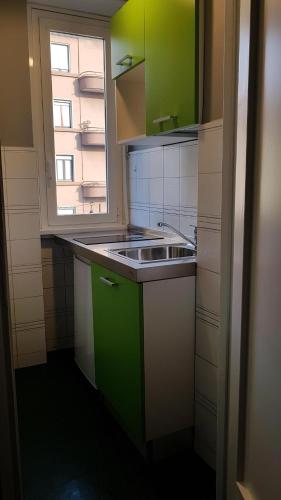 a small kitchen with a sink and a window at Residence Pian della Nave in Milan
