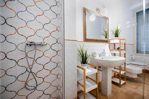 a bathroom with a sink and a shower at Adriatic Royal Sea View Apartment in Rovinj
