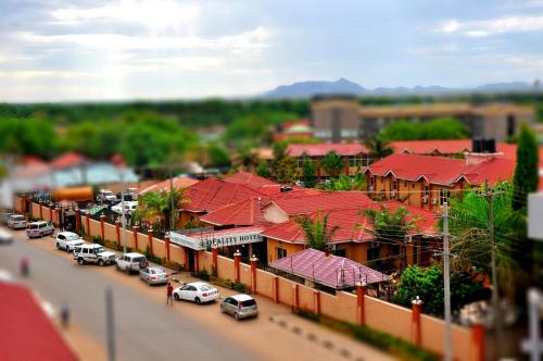 a model of a city with cars parked on a street at Quality Hotel Juba in Juba