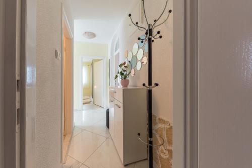 a hallway with a refrigerator in a room at Apartment Danijela II in Šibenik