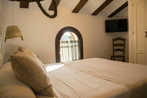 Una cama o camas en una habitación de Hotel Mariantonia