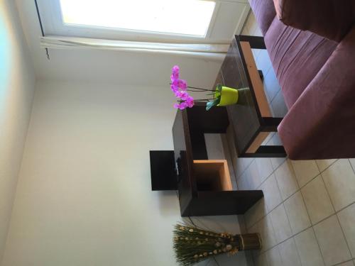 a room with a window and a flower on the wall at Résid'Artel Cadarache - ITER in Saint-Paul-lez-Durance