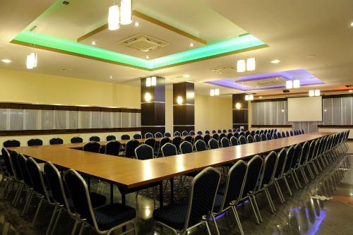 a large conference room with a long table and chairs at Hotel Aquarius Restaurant Wellness Spa in Ciechocinek