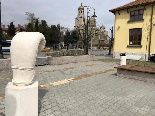 a statue of a parking meter on a street at Jivko's Studio in Varna City