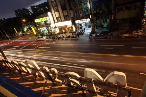 a view of a city street at night at May Rooms Taipei Nangang Station in Taipei
