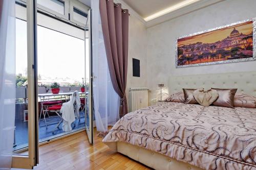 a bedroom with a large bed and a balcony at Luxury Rome Guest House in Rome