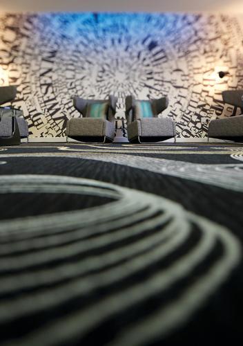 a close up of a chair in a room at Ramada Hotel & Suites by Wyndham Coventry in Coventry